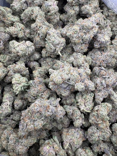 Super Sour OG Hemp Flower buds in a bag. 